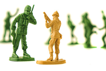 miniature toy soldiers on white background, close-up