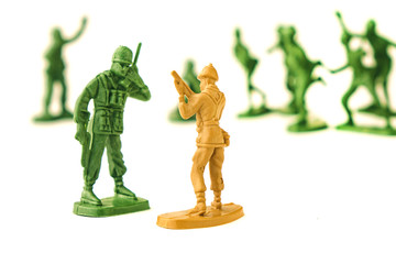 miniature toy soldiers on white background, close-up