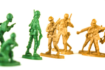 miniature toy soldiers on white background, close-up