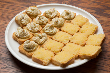 a lot of little sandwiches on bruschettas, a snack to wine, close-up