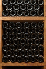 Showcase - stand with bottles of wine, vertical layout