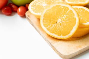 Fresh orange slices on chopping wood. fruit top view, vitamin C  concept.