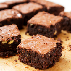 Homemade chocolate brownies on a baking sheet, low angle view. Close-up.