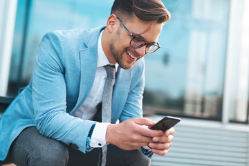 Businessman using phone apps