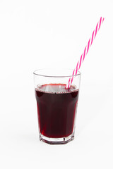 glass cup with red fruit cherry juice and a drinking can