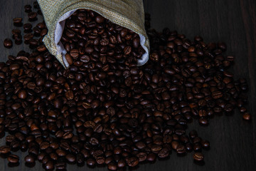 Coffee cup and coffee beans on the table
