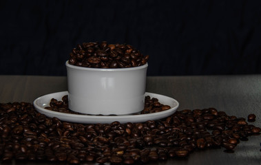 Coffee cup and coffee beans on the table