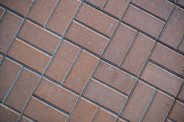 Texture of paving slabs overgrown with grass. Background image of a stratum stone