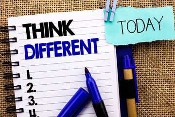 Word writing text Think Different. Business concept for Rethink Change on vision Acquire New Ideas Innovate written Notebooke Book the jute background Today Pens next to it.