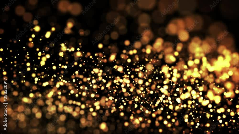 Wall mural gold shiny sparkling particles move in a viscous liquid. it is bright festive background with glitte