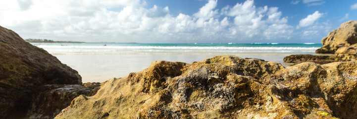 Panorama of a wild beach in the sandy bay of the blue tropical sea