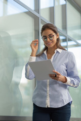 Positive delighted young woman preparing for meeting