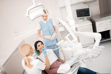 Woman getting her dental treatment before whitening.