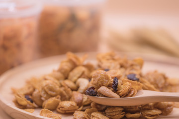 Delicious cereal caramel cornflakes warm tone background. A Breakfast cereal made by flakes of corn.