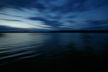 Fototapeta na wymiar blurred sky and lake at long exposure