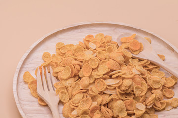 Delicious cereal cheese crispy cornflakes warm tone background. A Breakfast cereal made by flakes of corn.