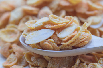 Delicious cereal cheese crispy cornflakes warm tone background. A Breakfast cereal made by flakes of corn.