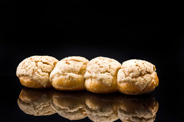 French Artisan Eclair on Black Reflective Background,Copy Space