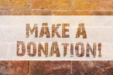 Text sign showing Make A Donation. Conceptual photo Donate giving things not used any more to needed showing Brick Wall art like Graffiti motivational call written on the wall