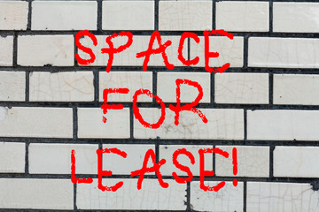 Conceptual hand writing showing Space For Lease. Business photo text Available location for rent to use for commercial purposes Brick Wall art like Graffiti motivational call written on the wall
