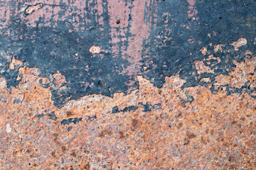 Grunge red brown rust on black metallic sheet textured background