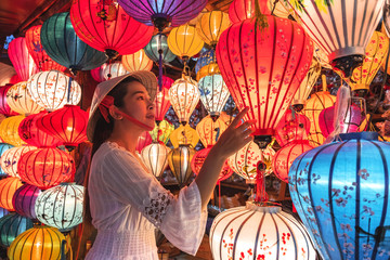 Travel woman choosing lanterns in Hoi An, Vietnam © Nichapa