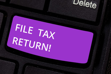 Text sign showing File Tax Return. Conceptual photo Paperwork to get financial money returning accountant job Keyboard key Intention to create computer message pressing keypad idea