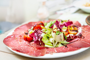 close up of tasty cold meats on the table
