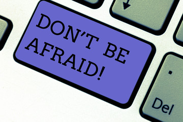 Conceptual hand writing showing Don T Be Afraid. Business photo showcasing Optimistic motivated everything is going to be all right Keyboard key Intention to create computer message idea