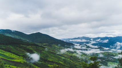 The mountains are covered with beautiful white clouds.