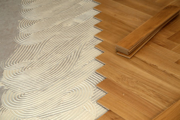 Construction in a renovated room installation of parquet