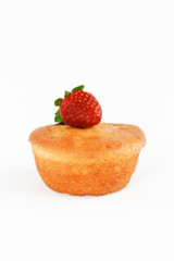 fresh sponge cake with strawberry decoration on a white background
