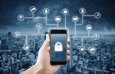 Mobile application and online data security system technology. Hand using mobile smart phone with lock and application icon
