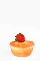 fresh sponge cake with strawberry decoration on a white background