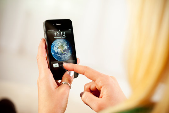Woman Ready To Unlock Home Screen On Apple iPhone 4
