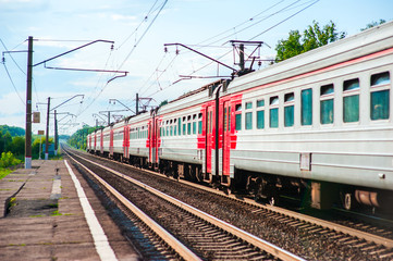 Electric train pulls up to the station platform