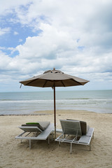 Beach chairs under ambrella on holiday