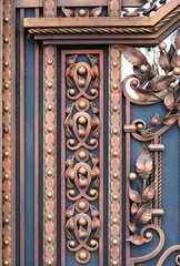 Forged metal elements on the gate. Industry