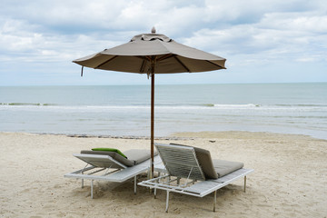 Beach chairs under ambrella on holiday