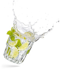 glass of flying and splashing mojito isolated on white
