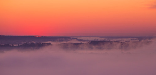 Fototapeta na wymiar Sunrise on misty valley
