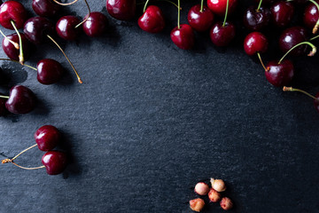 Cherries on a black background. Juicy cherries.
