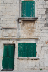 Green wooden windows and doors