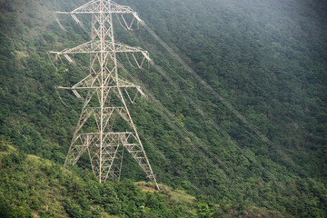 High voltage electric pole in the forest