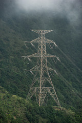 Obraz premium High voltage electric pole in the forest