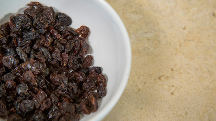 raisins on white plate, ingredient of 