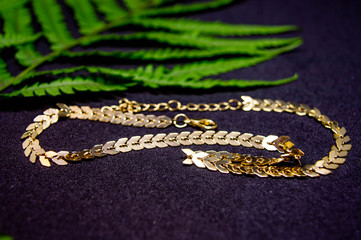 golden necklace on black background