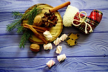 Christmas composition with toys, spruce, cones, nuts and cinnamon