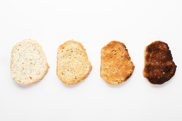 Croutons of different roasting. White background.