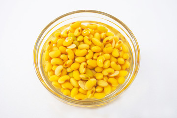 soaked soybean or soya bean in a glass bowl prepare for made soy milk or soya milk